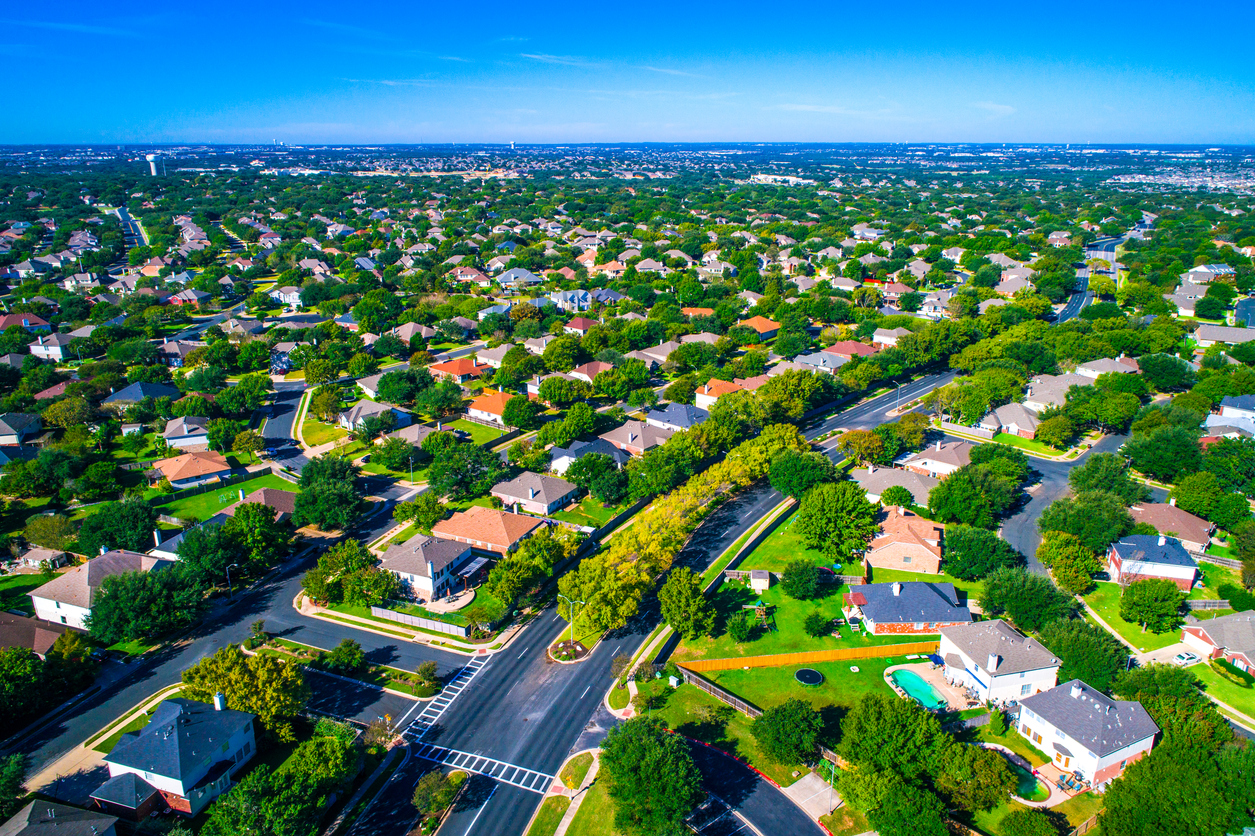 Growing suburban town Round Rock , Texas , USA aerial drone view high above Suburb Neighborhood with Vast amount of Homes