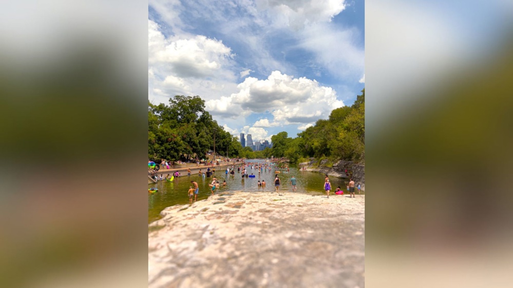 Barton Springs in Austin, Texas on a bustling Saturday afternoon